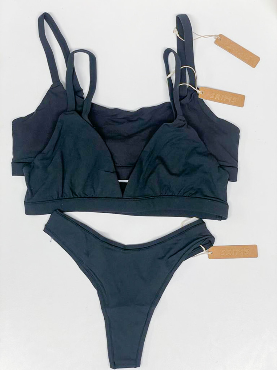 Shop bras by SKIMS: Fits everybody Triangle Bralette ($32), Fits everybody Scoop Neck Bra ($25.99)Shop underwear by SKIMS: Fits everybody Dipped Front Thong ($18)